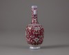 A red-ground famille-rose bottle-vase