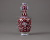 A red-ground famille-rose bottle-vase