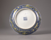 A Chinese yellow-glazed blue and white 'dragon' dish