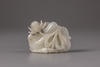A white and russet jade 'mandarin ducks and lotus' carving