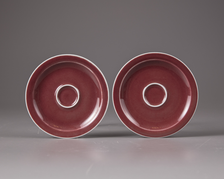 A pair of Chinese copper-red-glazed saucers