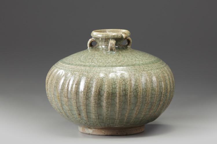 A celadon-crackle-glazed moulded jar