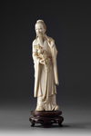 A Chinese ivory carving of a standing immortal
