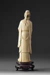 A Chinese ivory carving of a standing immortal