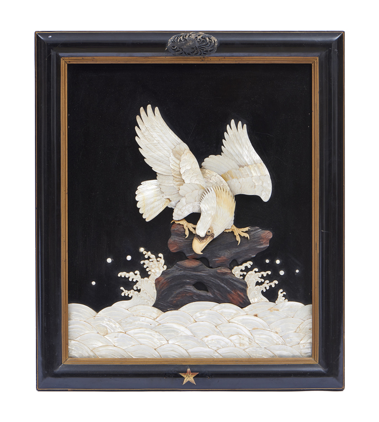An exceptional framed relief of an eagle perched on a rock