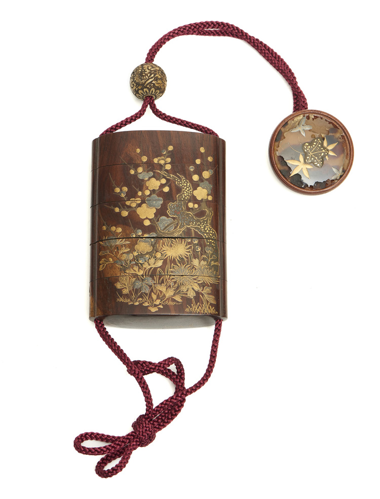 A five part inrō-case decorated with a floral design and (reverse) bamboo