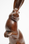 A brown bronze figure of a rabbit