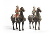 A pair of Chinese painted grey pottery figures of equestrians