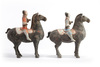 A pair of Chinese painted grey pottery figures of equestrians