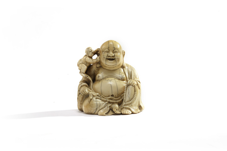 An ivory carving of Budai