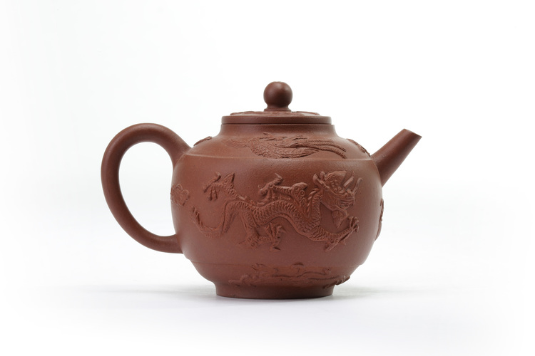 A Chinese yixing 'dragon and phoenix' teapot and cover