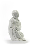 A Chinese Dehua figure of a seated Luohan