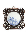 A Chinese blue and white circular plaque
