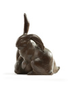 A Japanese wooden carving of two rabbits