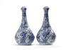 A pair of Chinese moulded blue and white 'Kraak' garlic neck vases