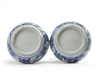 A pair of Chinese moulded blue and white 'Kraak' garlic neck vases