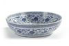 A Chinese Ming-style blue and white 'flower scroll' charger
