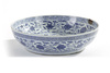 A Chinese Ming-style blue and white 'flower scroll' charger