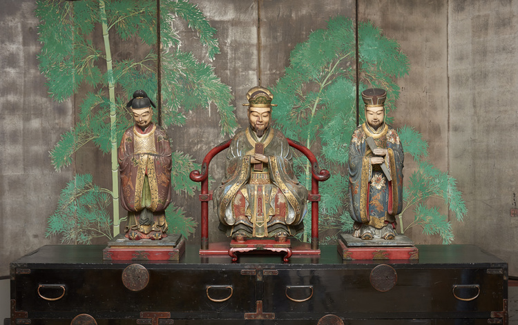 An important and rare set of three polychrome painted wooden figures