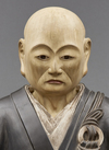 An important and very large painted wooden sculpture of a monk