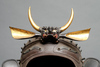An iron helmet with a plate nailed on top, resembling of the shield of a beetle (henkei kabuto)