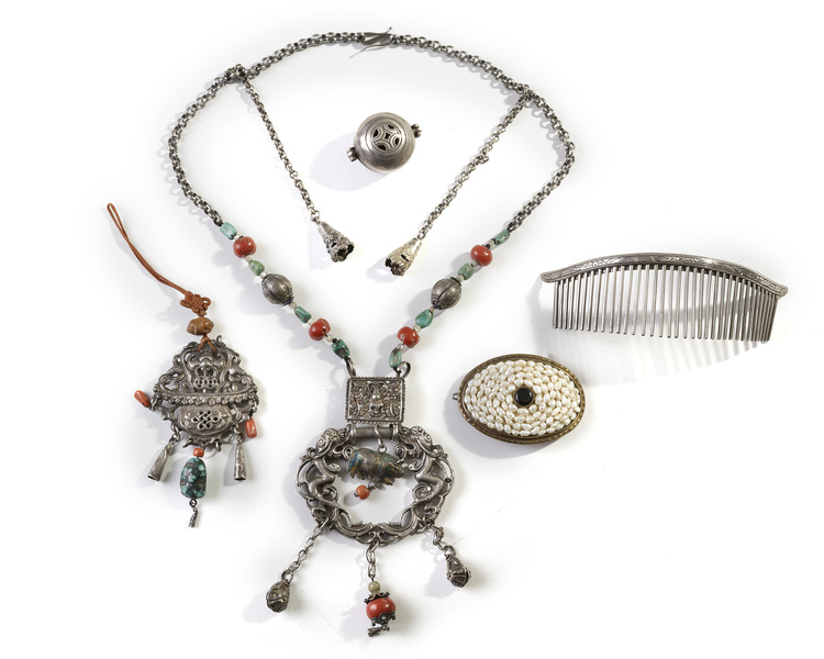 A group of Mongolian silver and metal accessories