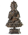 A Chinese gilt-lacquered bronze figure of Avalokitesvara