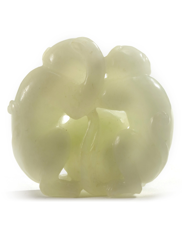 A Chinese white jade 'monkey and peach' group