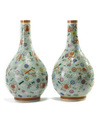 A pair of Chinese famille rose celadon-ground slip-decorated bottle vases