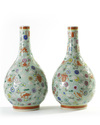A pair of Chinese famille rose celadon-ground slip-decorated bottle vases