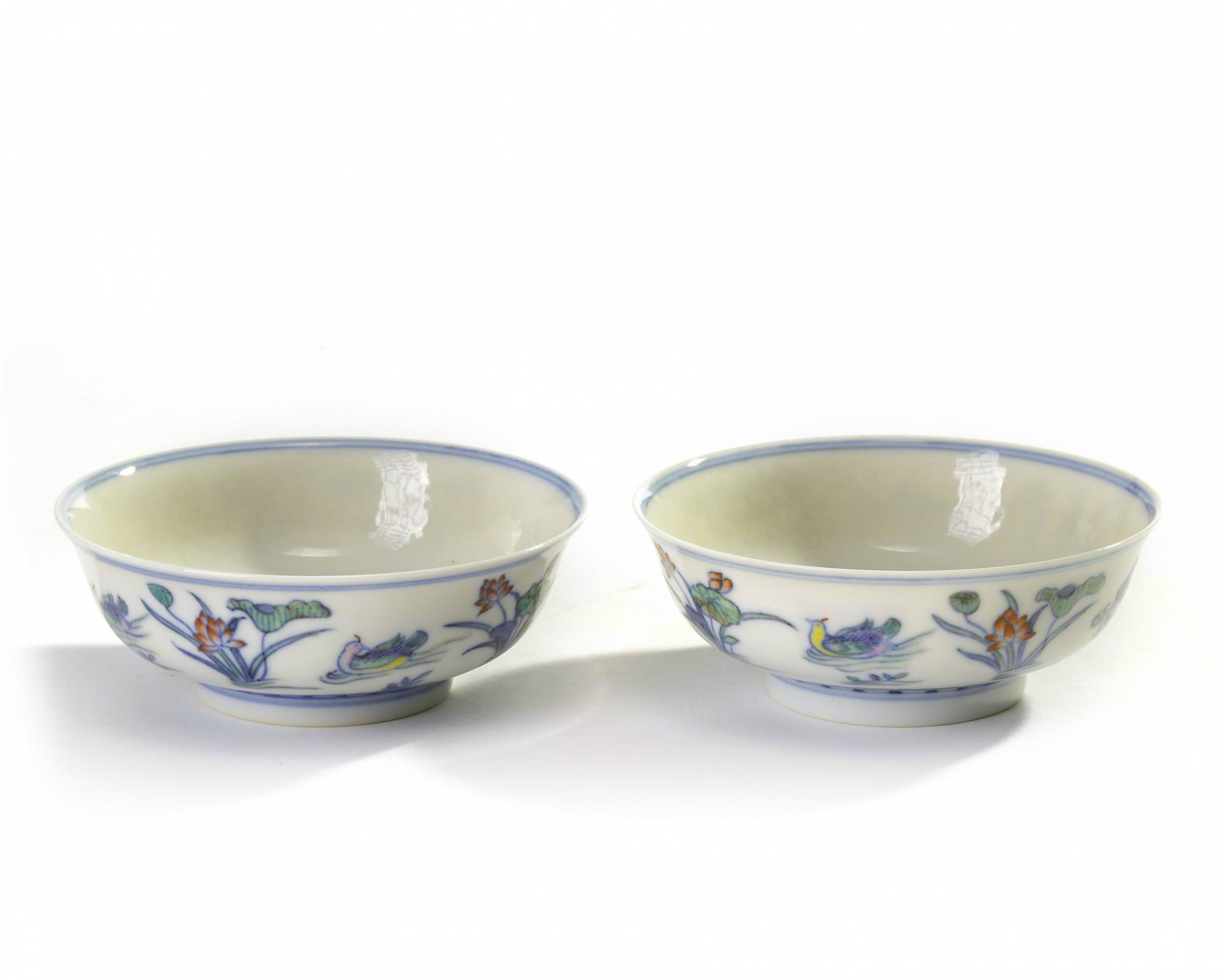 A pair of Chinese doucai 'mandarin duck and lotus' shallow bowls