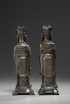 A pair of Chinese parcel gilt bronze standing scholars