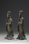 A pair of Chinese parcel gilt bronze standing scholars