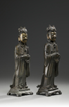 A pair of Chinese parcel gilt bronze standing scholars