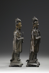 A pair of Chinese parcel gilt bronze standing scholars
