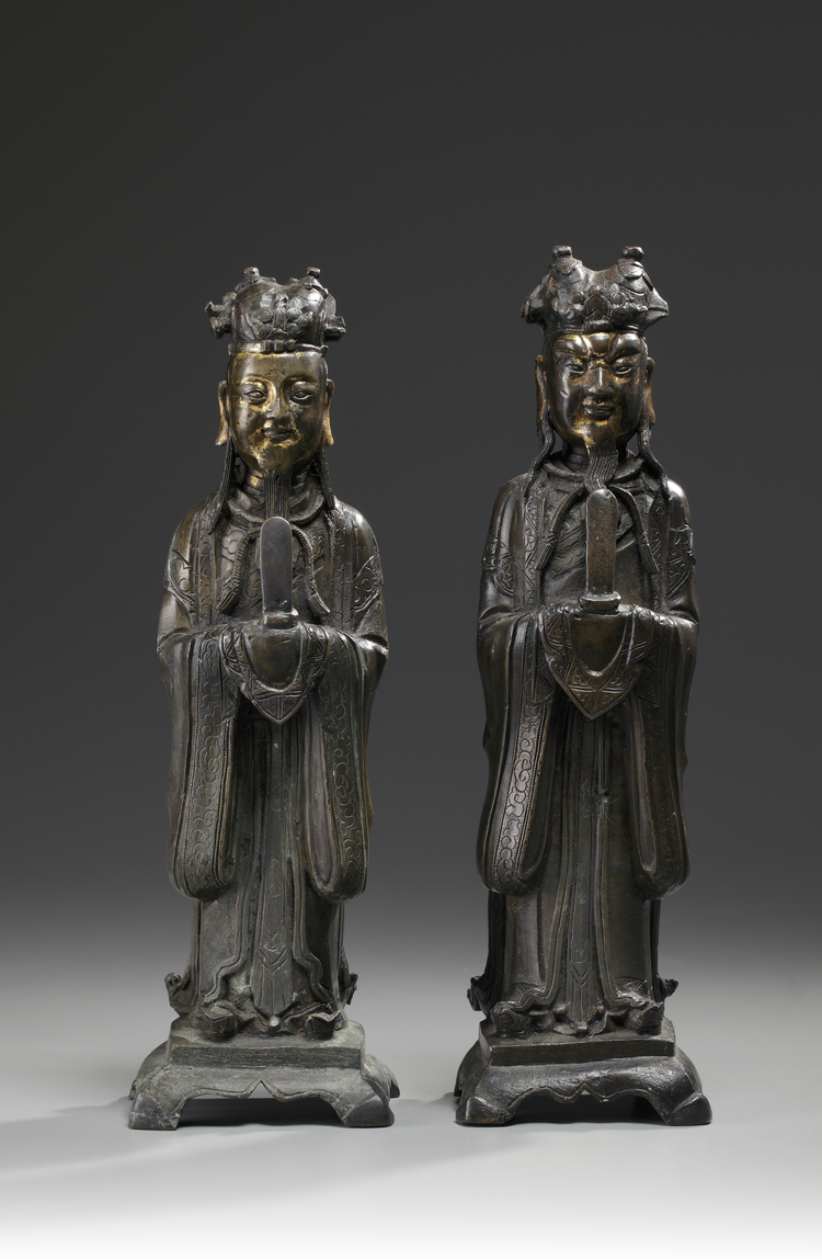 A pair of Chinese parcel gilt bronze standing scholars