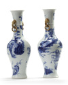 A matched pair of Chinese blue and white twin-handled slender vases