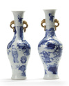 A matched pair of Chinese blue and white twin-handled slender vases