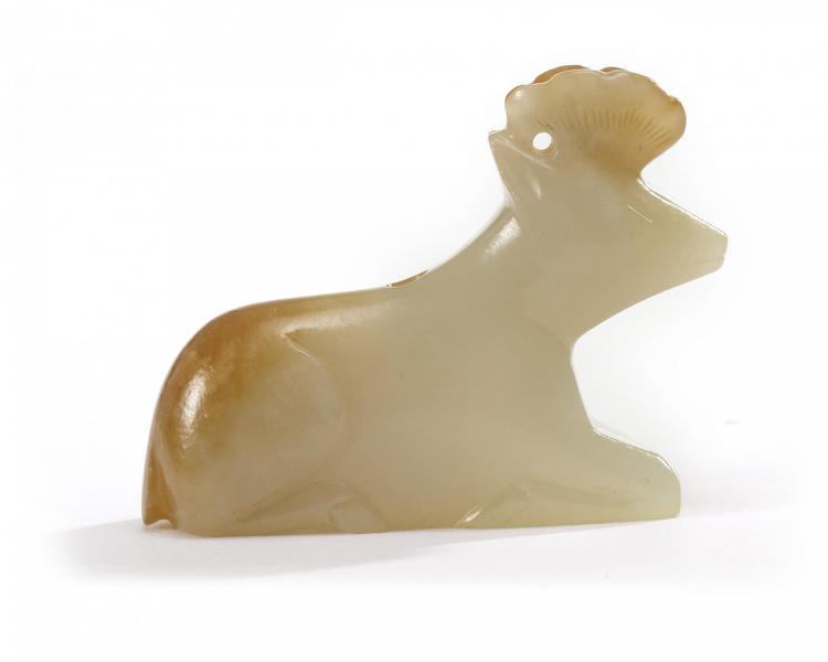 A Chinese celadon and russet jade 'deer' toggle