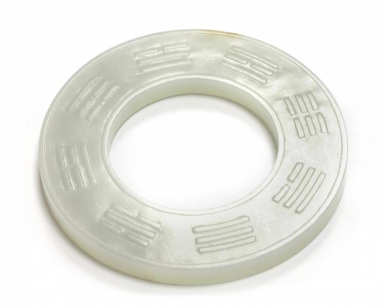 A Chinese white jade 'zodiac' bi disc