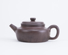 A Chinese yixing teapot and cover