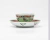 A famille verte cup and saucer