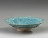 A Islamic Kashan turquoise glazed pottery dish
