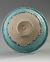 A Islamic Kashan turquoise glazed pottery dish