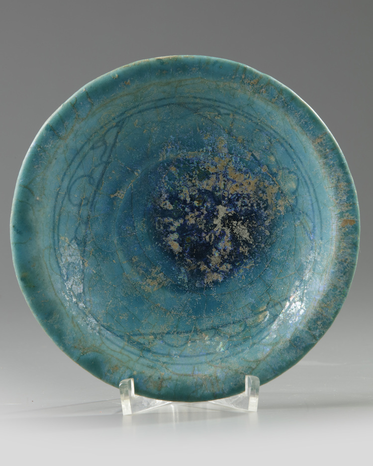 A Islamic Kashan turquoise glazed pottery dish