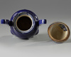 A Chinese blue-glazed tripod censer and cover