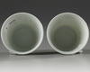 A pair of Chinese famille rose 'bird and lily' cups
